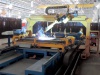Robotic center for assembly and welding of a dump truck back door