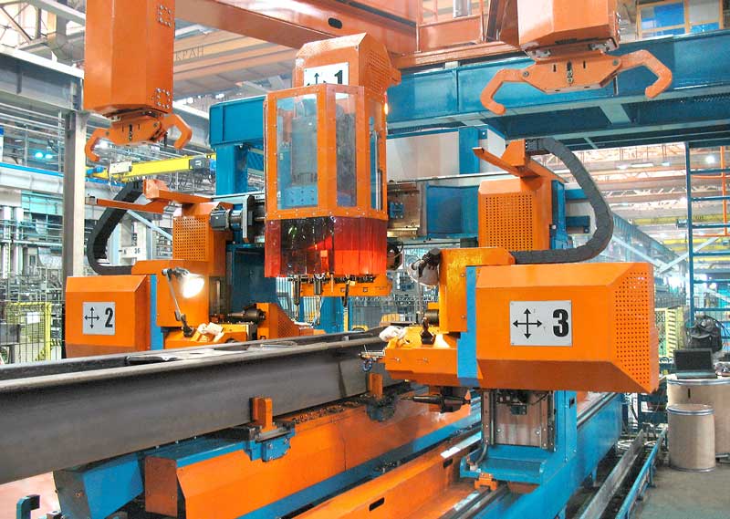 Automated drilling center for freight cars center sills